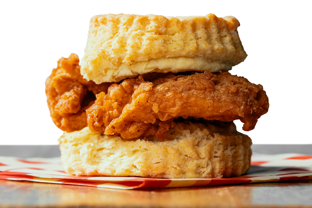 A fried-chicken biscuit cut to show the layers