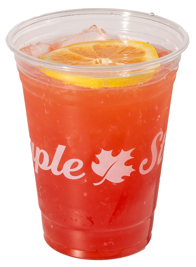 A tall glass of peach-berry lemonade with ice